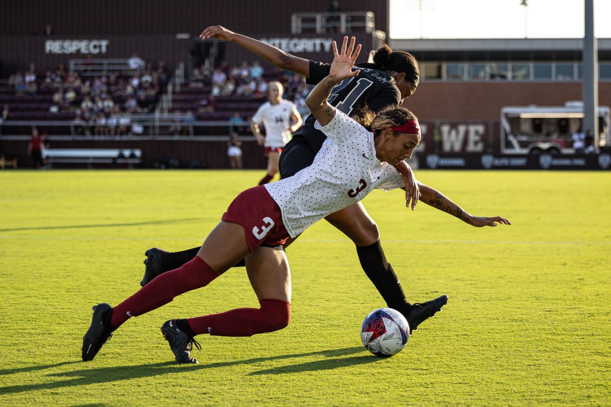 <p>Junior F Jazmine Wilkinson (21) trips up an Arkansas defender during Texas A&M's game against Arkansas on Saturday, Sept. 24, 2023 at Ellis Field.</p>