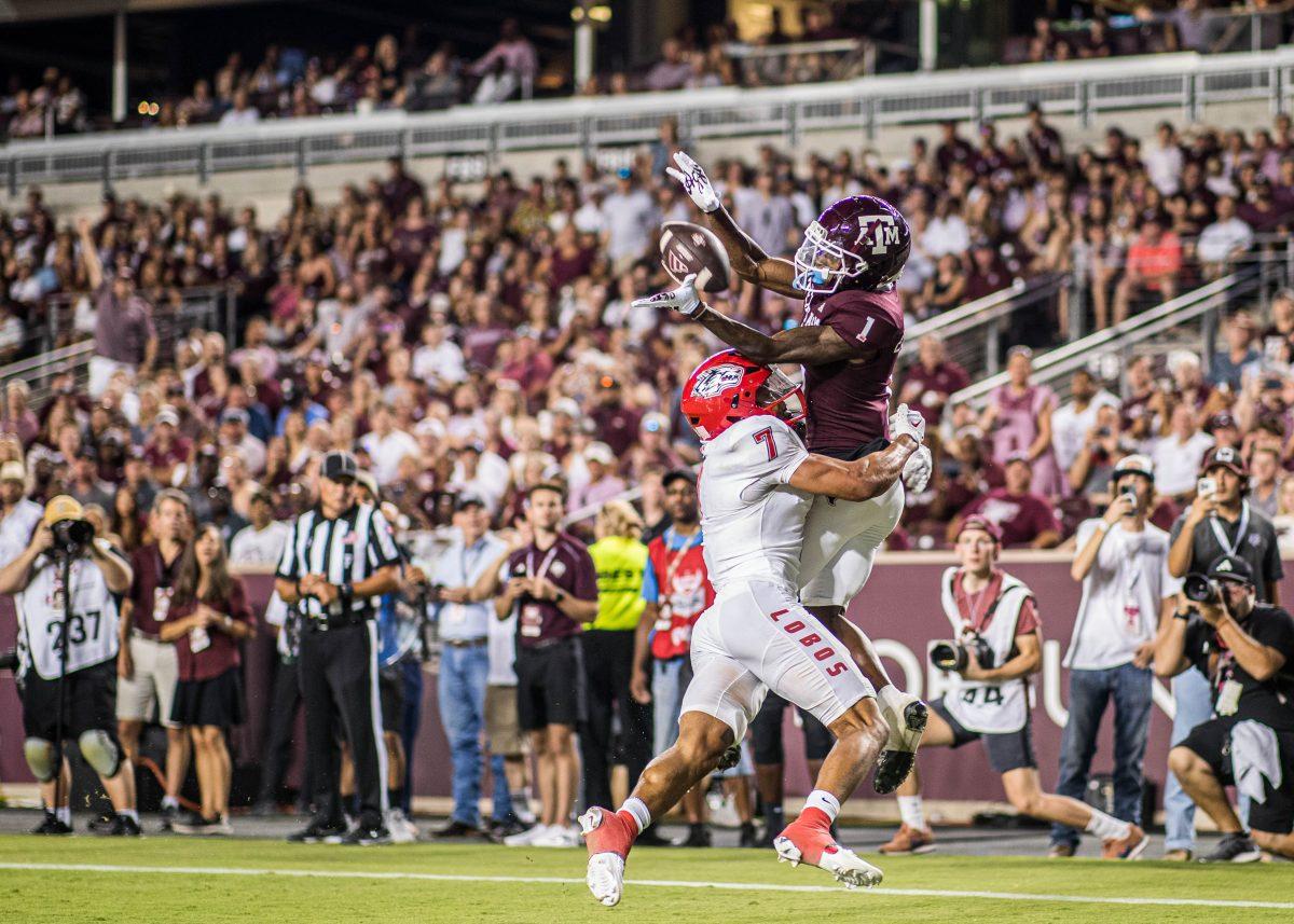 Sophomore WR Evan Stewart (1) gets hit by New Mexico S Tavian Combs (7) while catching a pass in the endzone during a game vs. New Mexico on Saturday, Sept. 2, 2023 at Kyle Field.