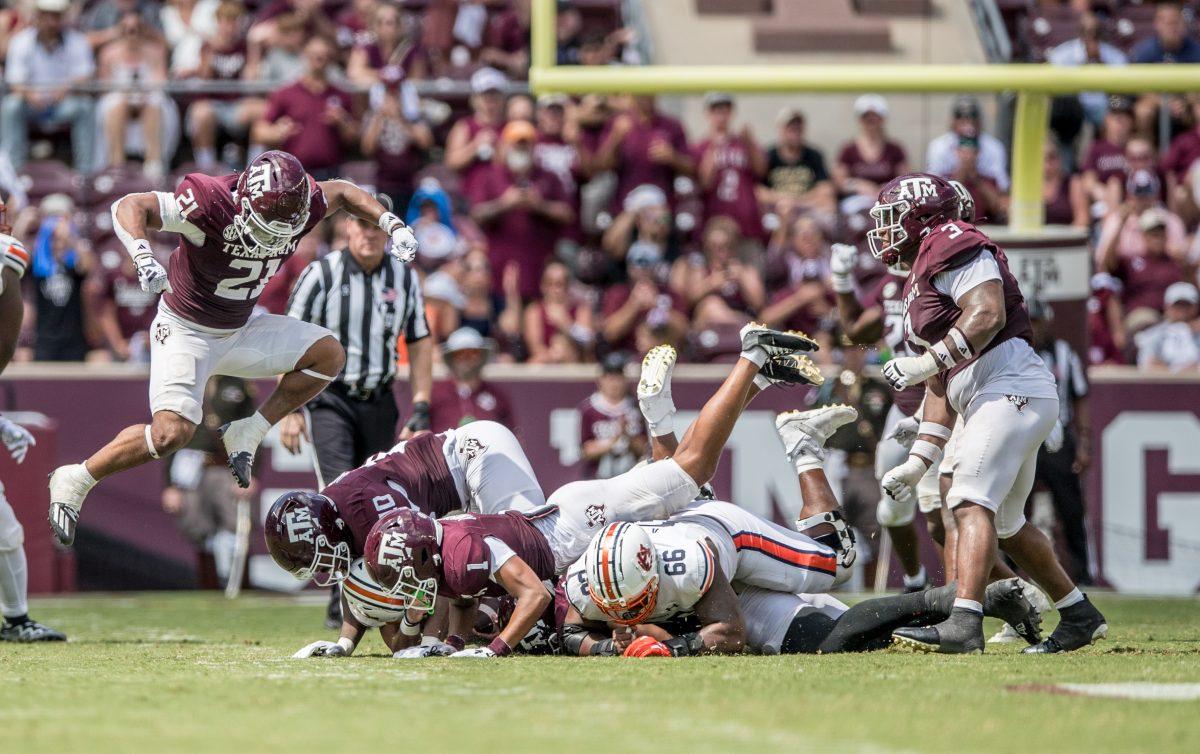 Freshman LB Taurean York (21) celebrates after bringing down Auburn QB Robby Ashford (9) during Texas A&amp;M's game against Auburn on Saturday, Sept. 23, 2023 at Kyle Field. (Ishika Samant/The Battalion)