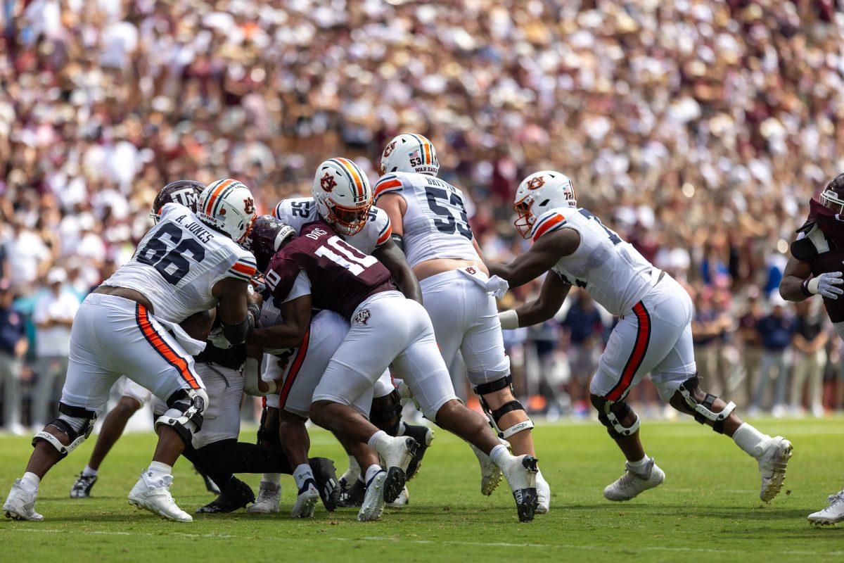 Junior DL Fadil Diggs (10) sacks the quarterback during Texas A&Ms game against Auburn on Saturday, Sept. 23, 2023 at Kyle Field. (CJ Smith/The Battalion)