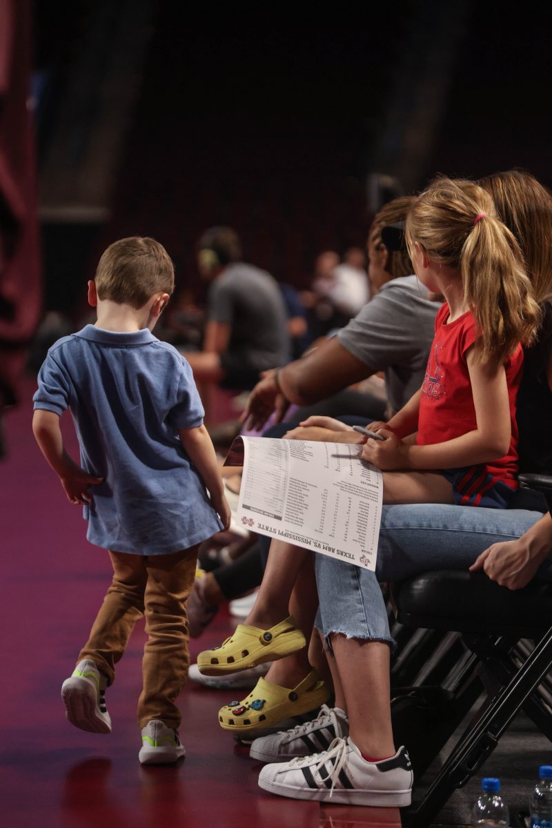 A young fan is dancing on the sidelinen during Texas A&Ms game against Mississippi State on Wednesday, Sept. 20, 2023.