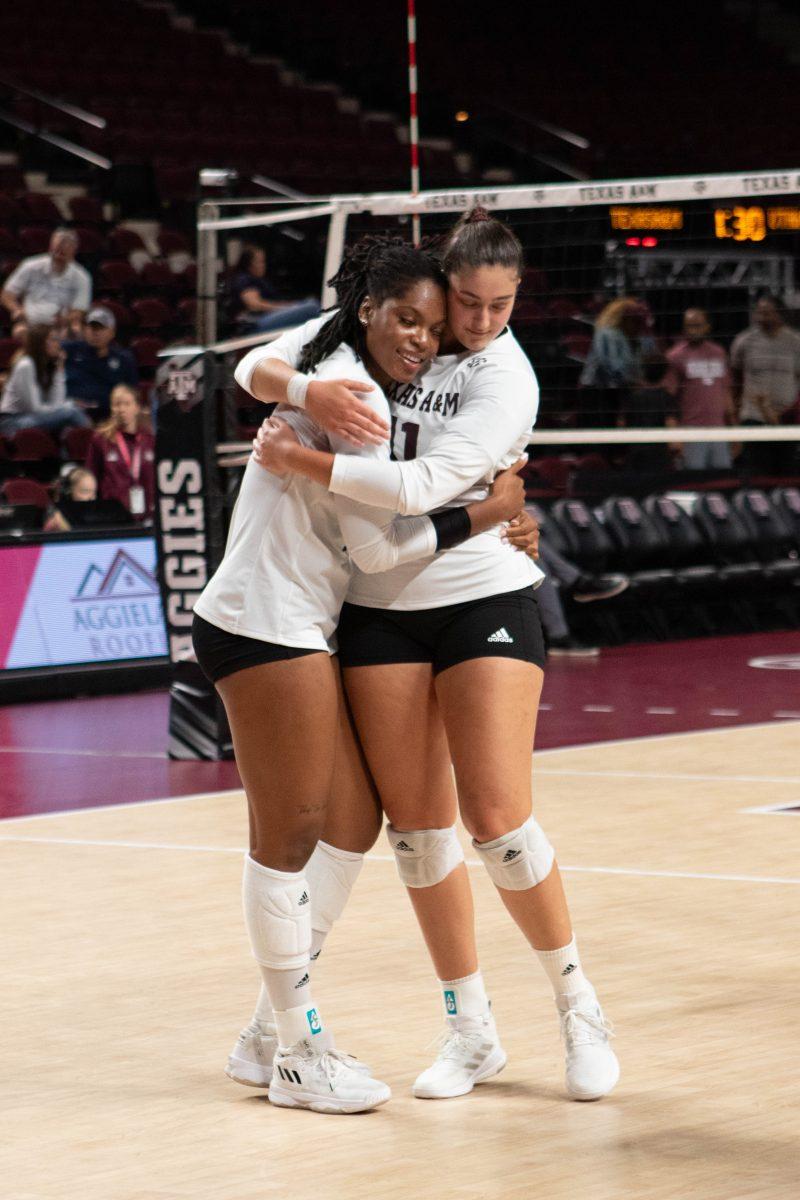 <p>Junior S Nisa Buzlutepe (11) and Sophomore MB Ifenna Cos-Okpalla (1) hug after their team wins at Texas A&M's game against Utah State on Thursday, Sept. 7, 2023 at Reed Arena. (Julianne Shivers/ The Battalion)</p>