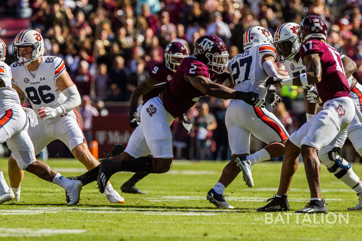 Coming in from both sides, senior Michael Clemons and sophomore Jaylon Jones take down the Auburn offense.