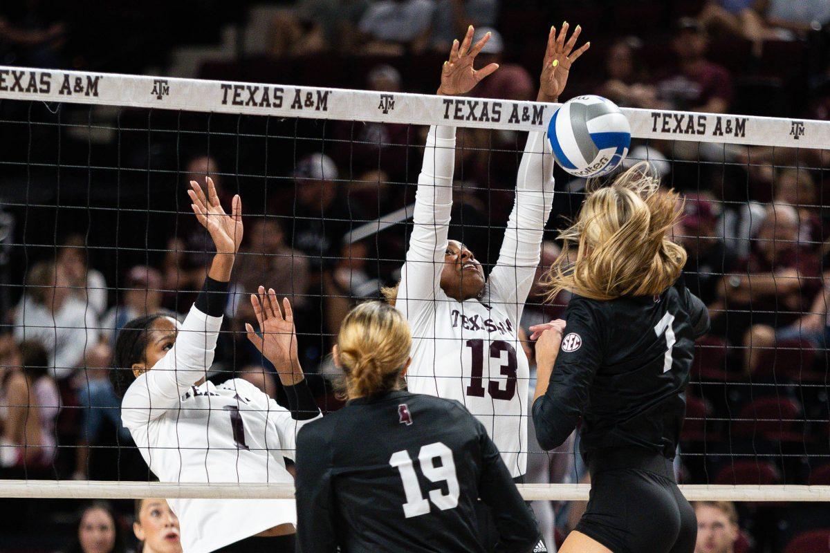 Sophomore MB Ifenna Cos-Okpalla (1) and Freshman OH Bianna Muoneke (13) jump to block the ball during Texas A&Ms game against Mississippi State at Reed Arena on Wednesday, Sept. 20, 2023.