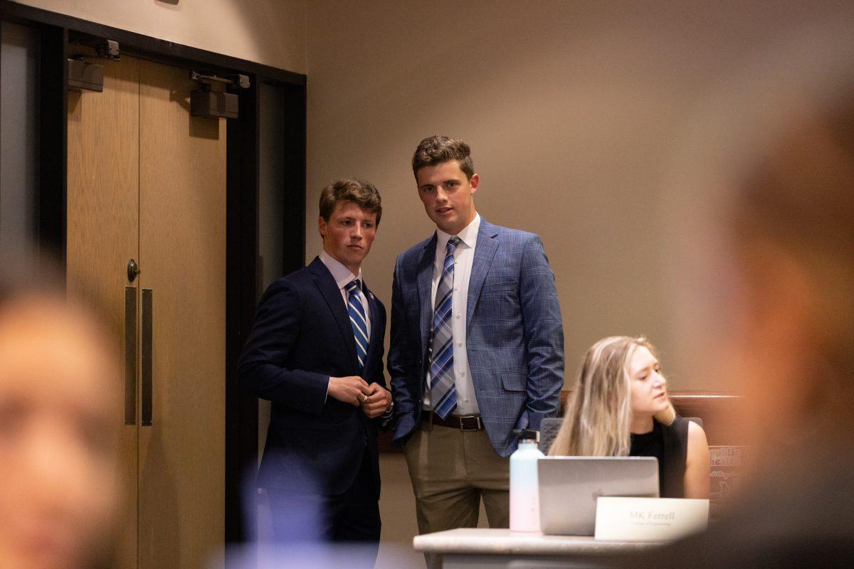 Senior Student Body President Hudson Kraus speaks with Senior Executive VP of Operations Grayson Sims at the Student Senate meeting on Wednesday, Sept. 13, 2023. (Chris Swann/The Battalion)&#160;