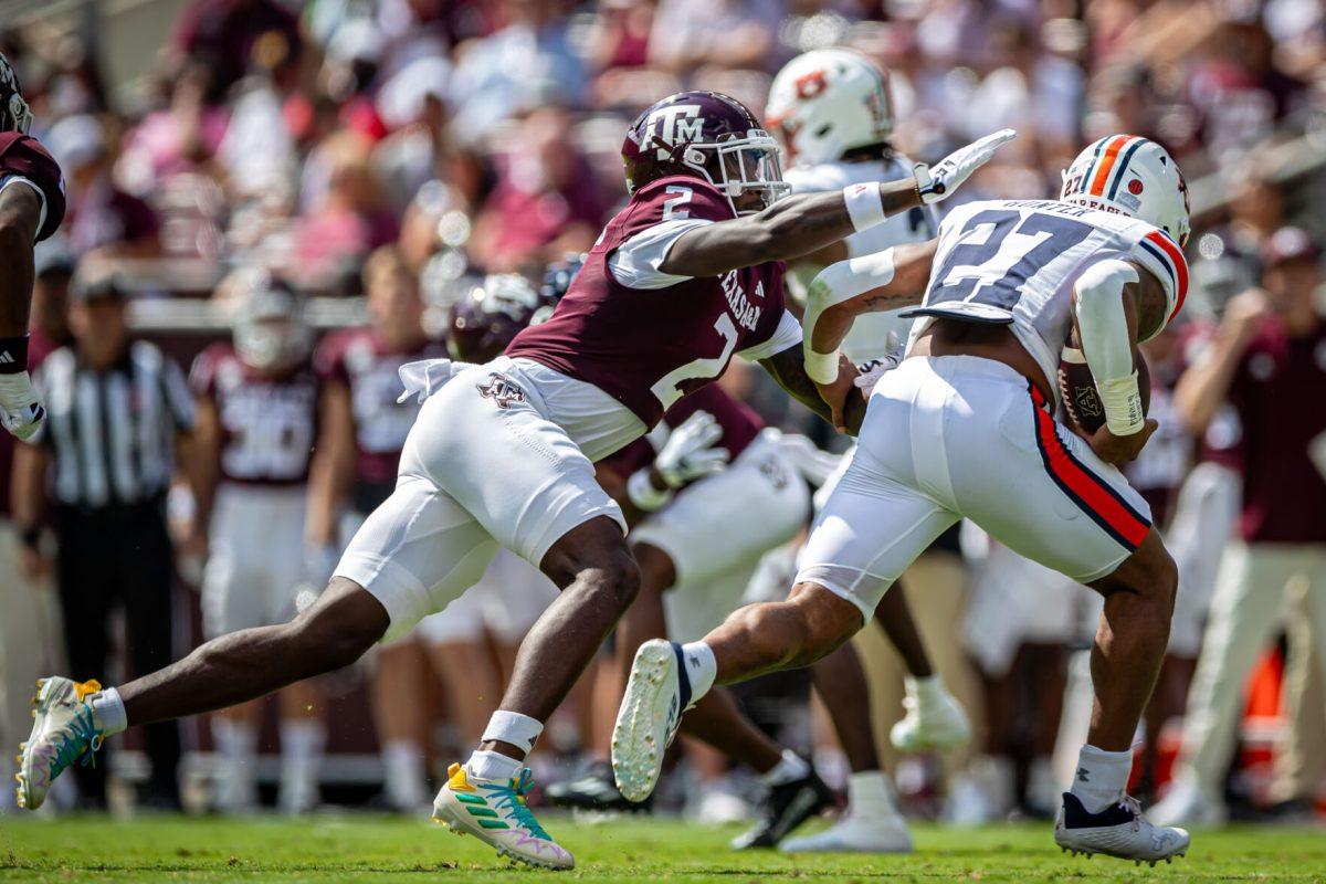 Sophomore DB Jacoby Mathews (2) tackles Auburn RB Jarquez Hunter (27) during Texas A&amp;M's football game against Auburn at Kyle Field on Saturday, Sept. 23, 2023.