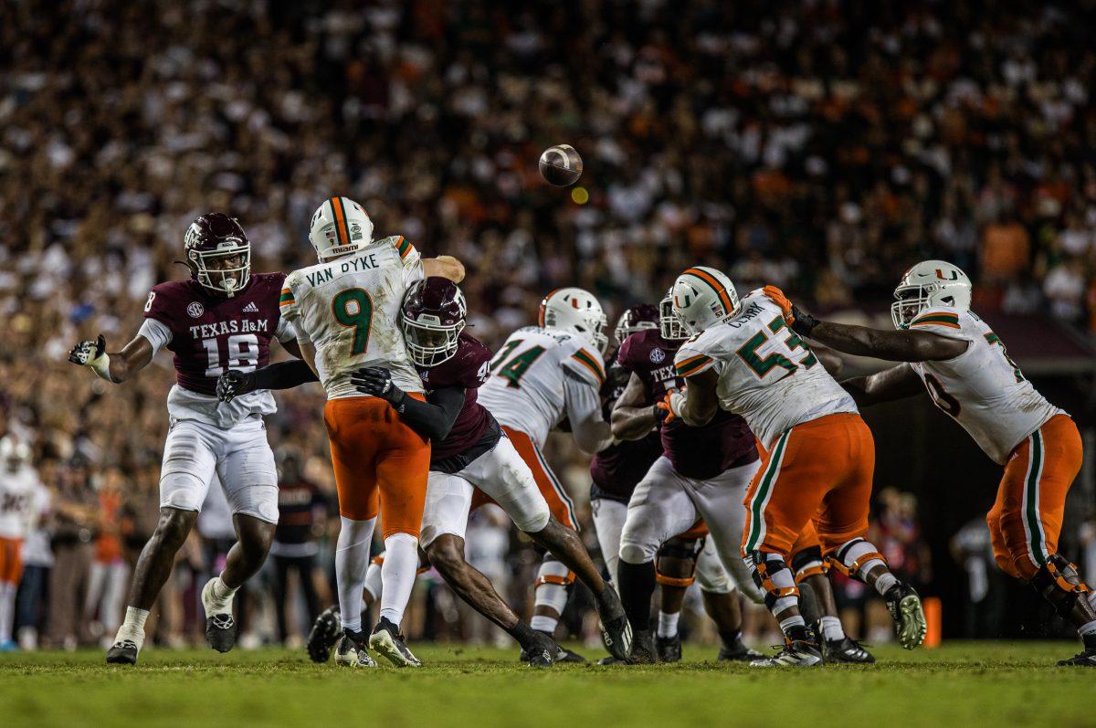 <p>Sophomore LB Edgerrin Cooper (45) tackles Miami QB Tyler Van Dyke (9) as he throws the ball away during Texas A&M's game against Miami at Kyle Field on Saturday, Sept. 17, 2022.</p>
