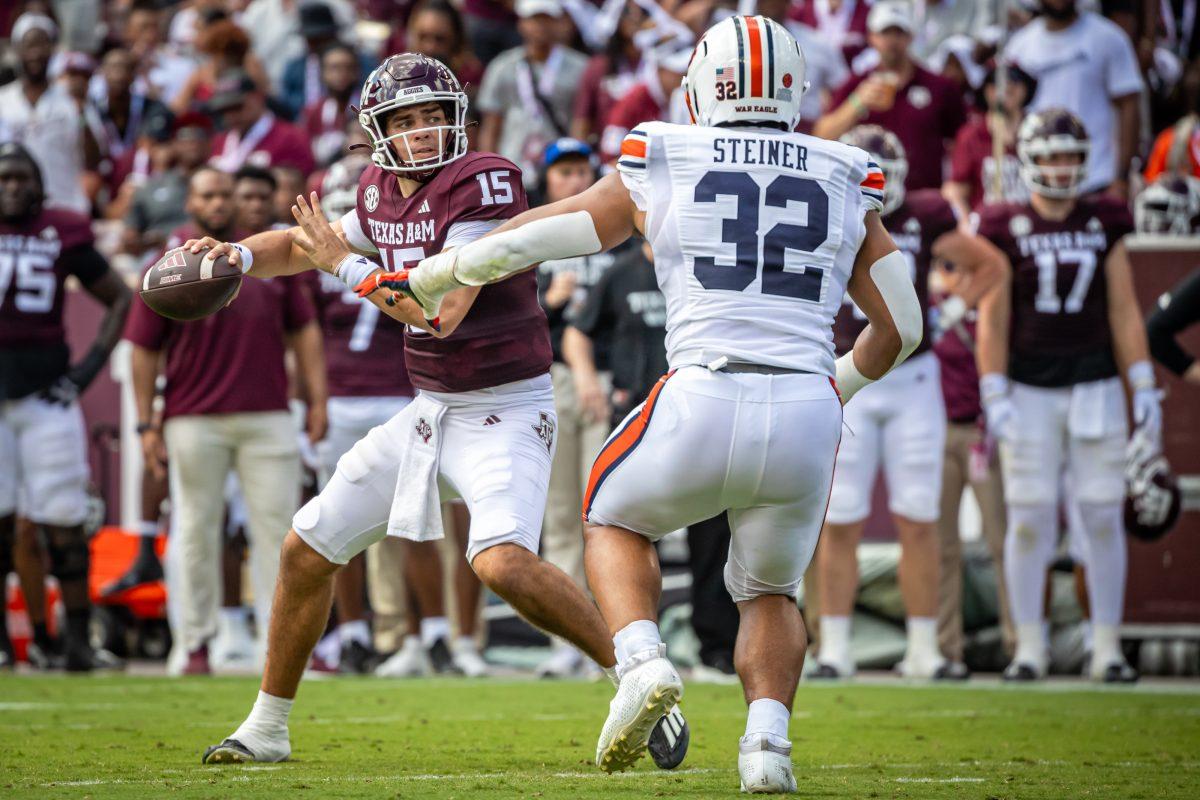 Sophomore QB Conner Weigman (15) throws a forward pass during Texas A&amp;M's football game against Auburn at Kyle Field on Saturday, Sept. 23, 2023.