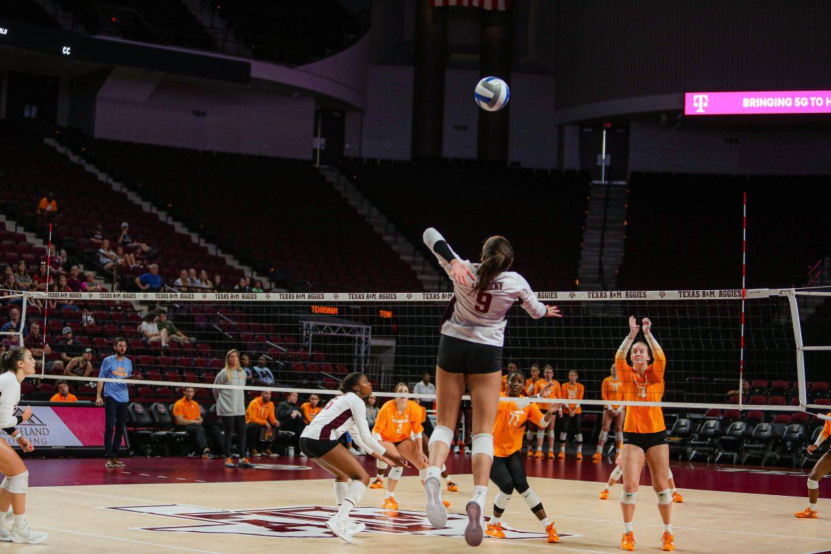 Freshman OPP Logan Lednicky (9) &#160;Jumps to hit the ball at Reed Arena on Sept. 25, 2022