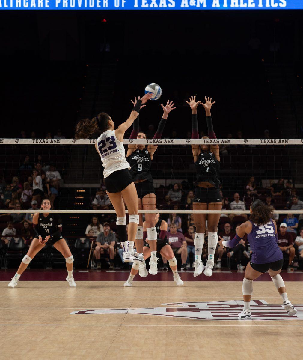 Sophomore OPP Logan Lednicky (9) and Sophomore MB Ifenna Cos-Okpalla (1) jump to block TCU OH Melanie Parras (23) spike during Texas A&Ms game against TCU at Reed Arena on Saturday, Sept. 9, 2023.