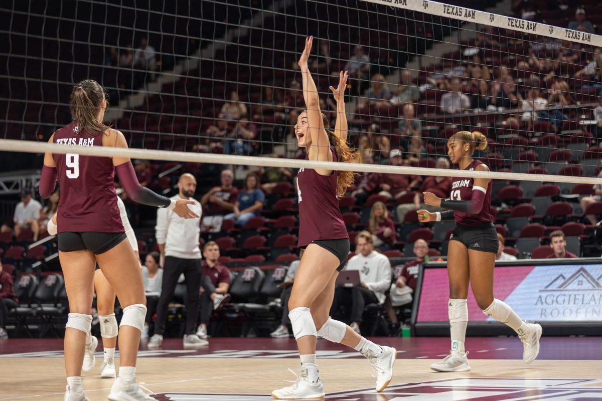 Junior MB Molly Brown (14) celebrates getting the final point in the second set during Texas A&Ms game against Liberty on Friday, Sept. 15, 2023 at Reed Arena. (CJ Smith/The Battalion)