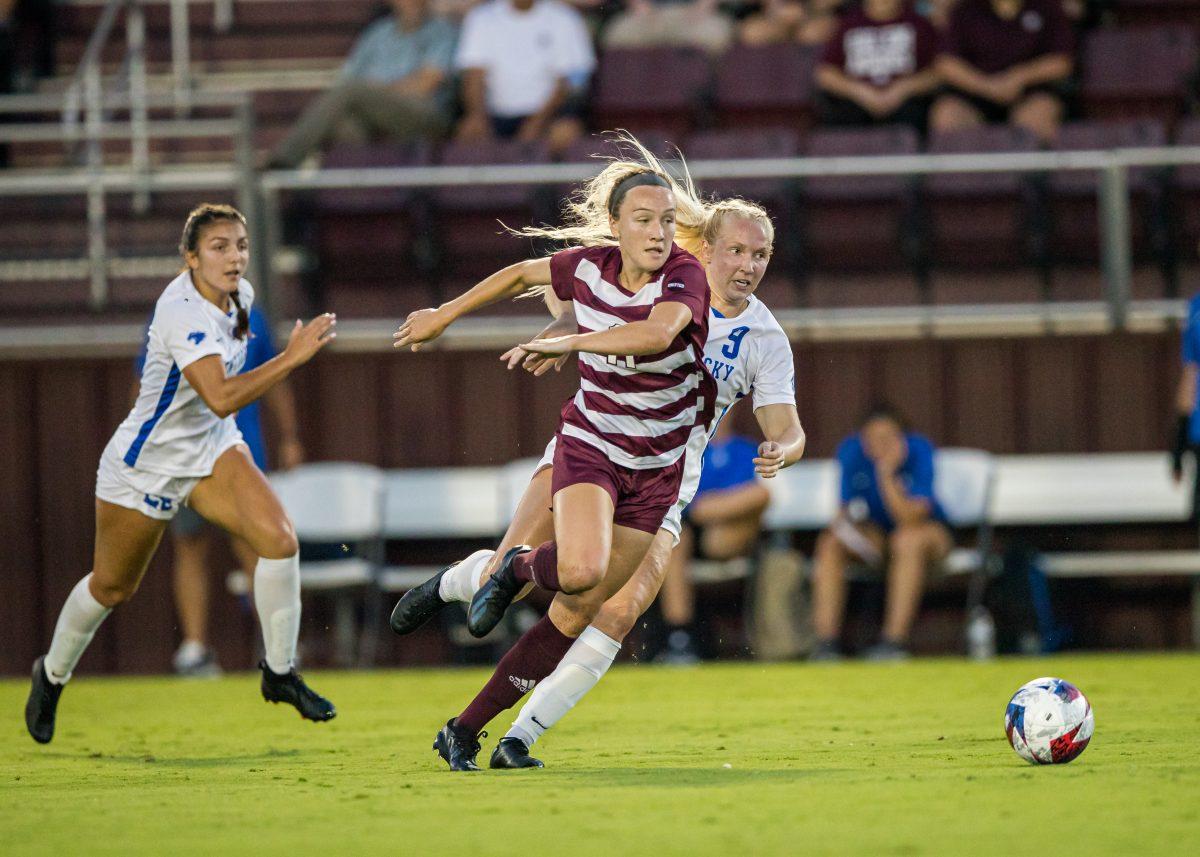 Graduate F Sammy Smith (11) pushes the ball up the field while Kentucky D Maggy Henschler (9) tries to gain possession of the ball during the first half of Texas A&Ms game against Kentucky on Friday. Sept. 15, 2023. (Ishika Samant/The Battalion)
