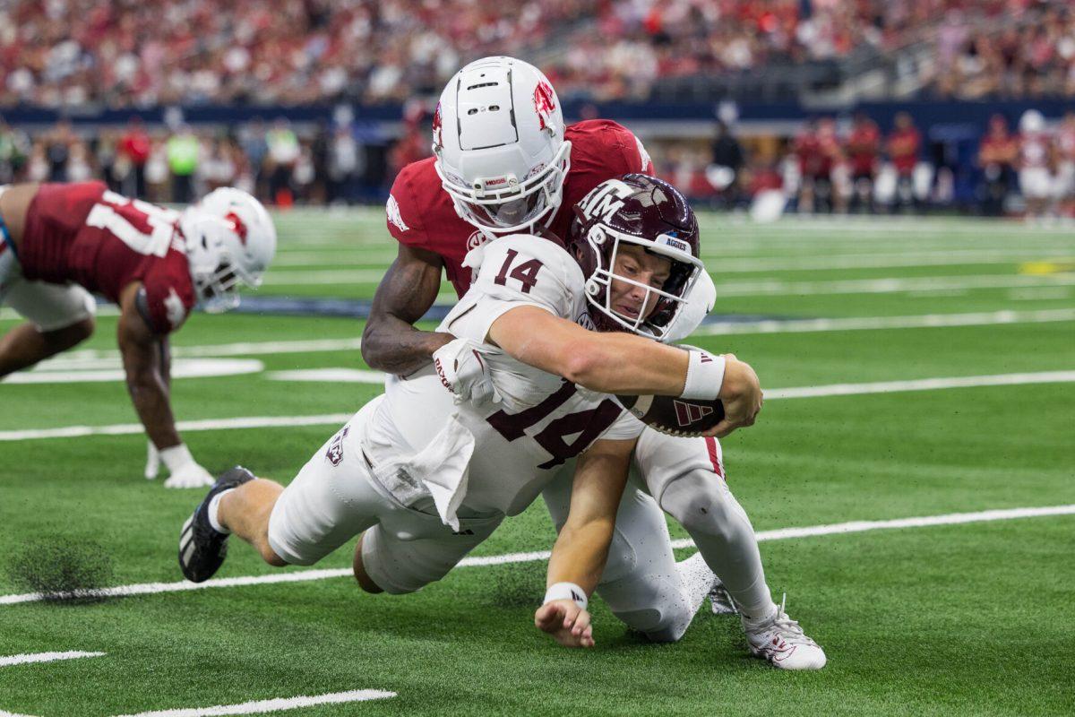 Sophomore QB Max Johnson dives into a first down during the Southwest Classic against Arkansas at AT&amp;T Stadium on Saturday, Sept. 30, 2023. (Chris Swann/The Battalion)