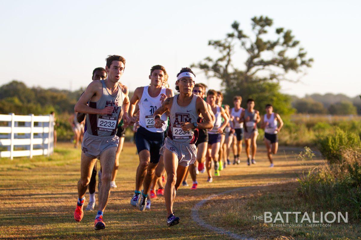 Joeseph Benn and Jonathan Chung run side by side during the 2021 Aggie Invitational cross country meet on Sept. 25, 2021