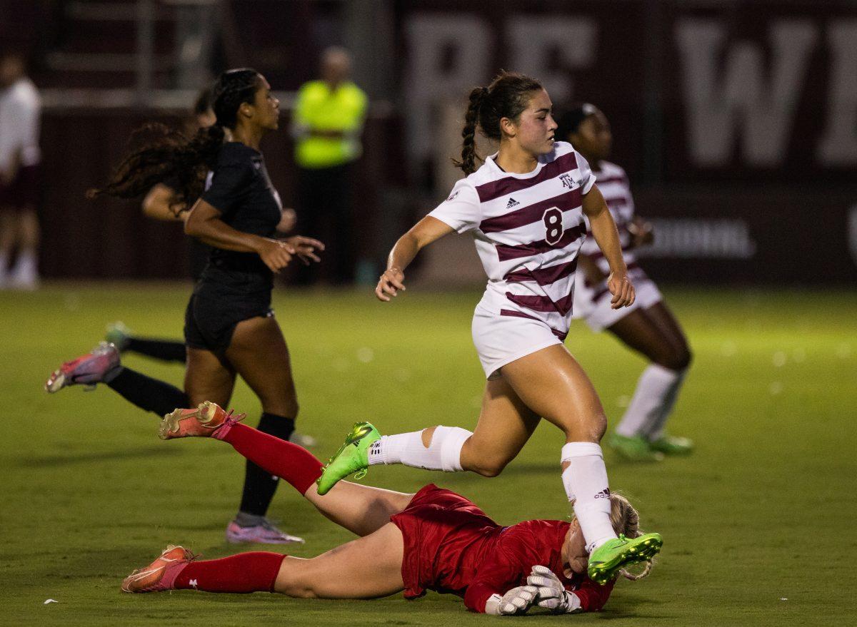 Junior F Maile Hayes jumps over Texas Southern GK Alyssa Hart (0) as she makes another goal at Texas A&amp;M's game against Texas Southern at Ellis Field on Sunday Sept. 17, 2023. (Connor May/The Battalion)