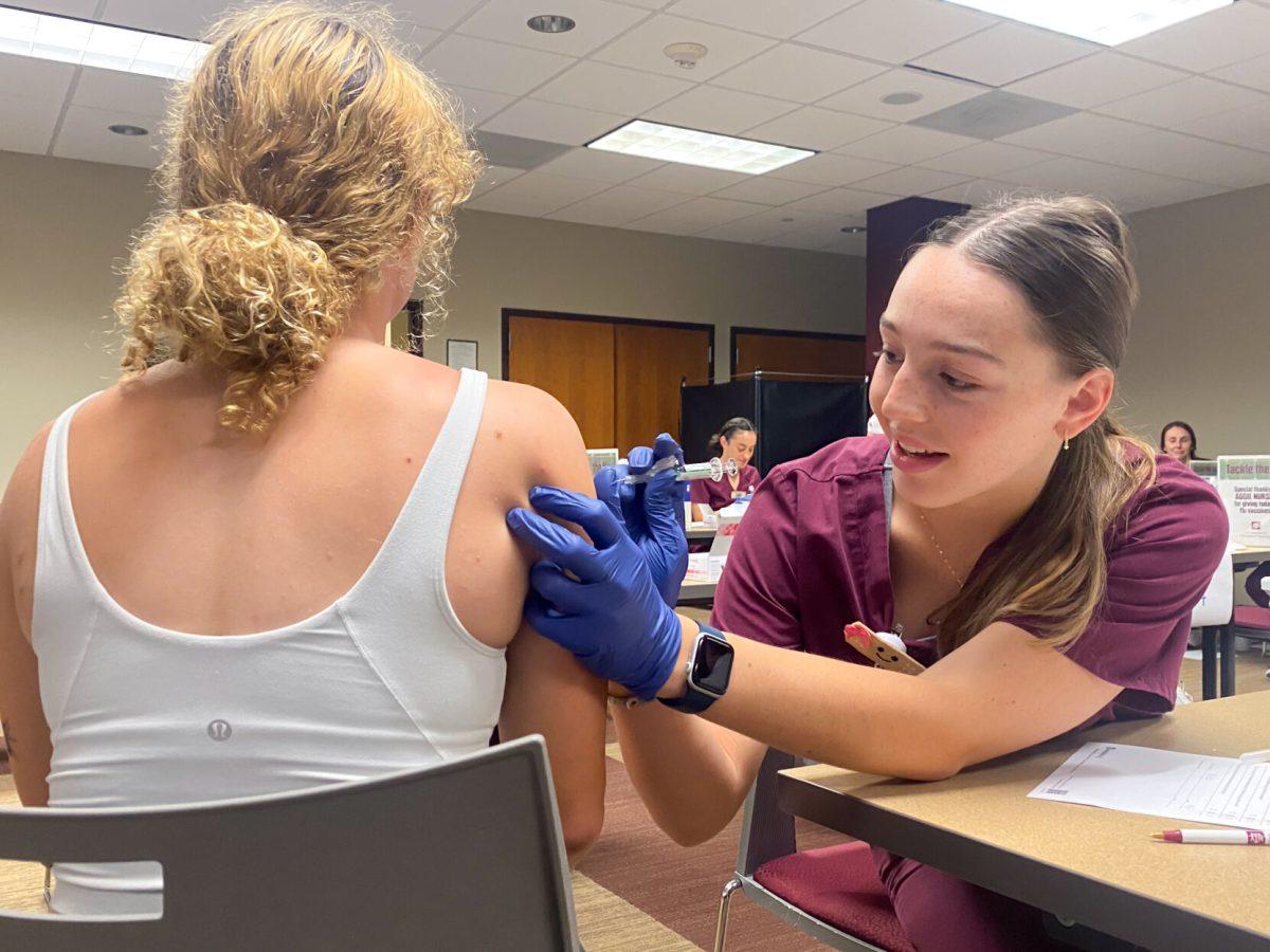 Texas A&amp;M student nurse administers a flu shot to a patient on Thursday, Oct. 5, 2023 at Beutel Student Health Center. (CJ Smith/The Battalion)