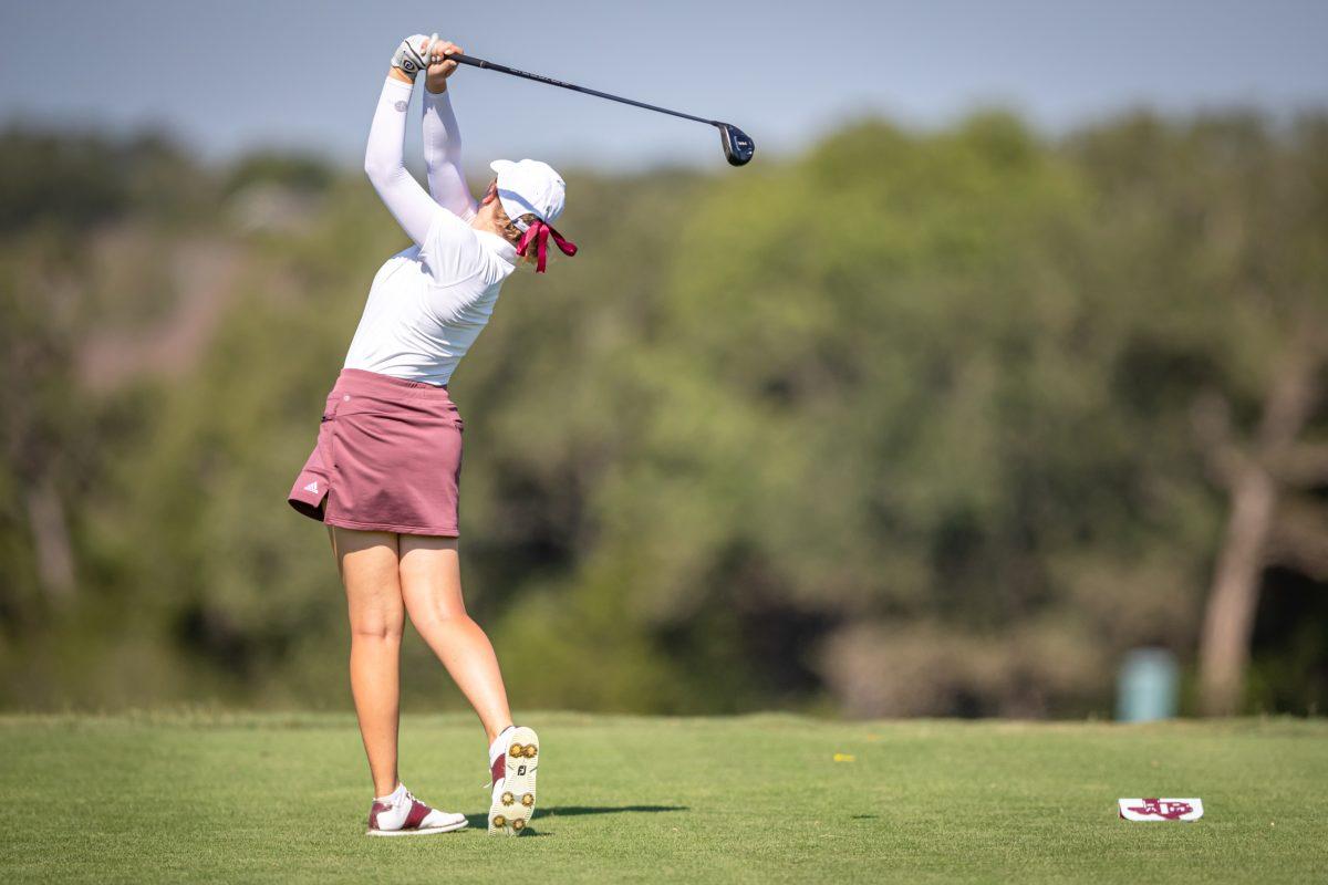 <p>Sophomore Adela Cernousek plays her tee shot on the 12th hole of the Traditions Club on the second day of the 