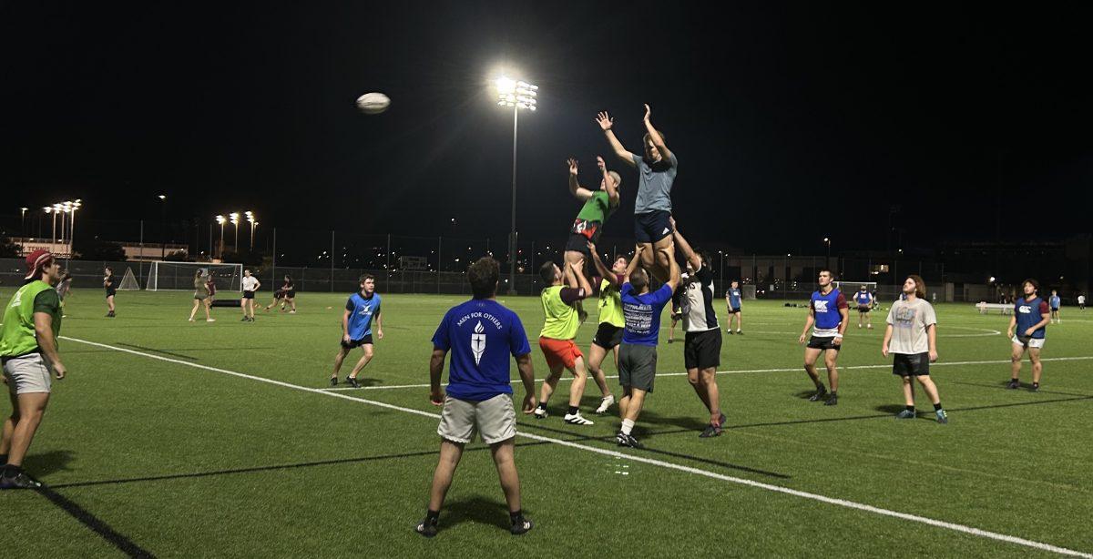 Men’s rugby practices lifting in the open during play as part of team practice Oct. 6 at Penberthy Fields. 