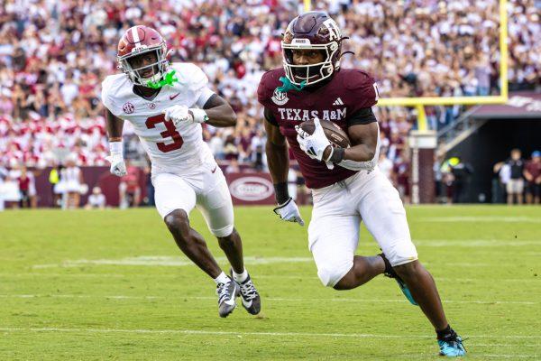 <p>Graduate WR Ainias Smith (0) runs with the ball towards the end zone during Texas A&M's football game against Alabama at Kyle Field on Saturday, Oct. 7, 2023. (Chris Swann/The Battalion)</p>