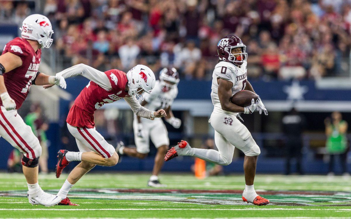 <p>Graduate WR Ainias Smith (0) returns a punt for a touchdown during the Southwest Classic against Arkansas on Saturday, Sept. 30, 2023. (Ishika Samant/The Battalion)</p>