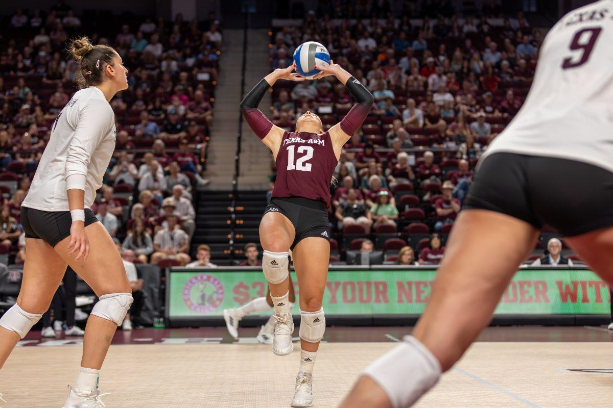 <p>Sophomore L/DS Ava Underwood (12) sets the ball during Texas A&M's game against Georgia on Sunday, Oct. 22, 2023 at Reed Arena. (CJ Smith/The Battalion)</p>