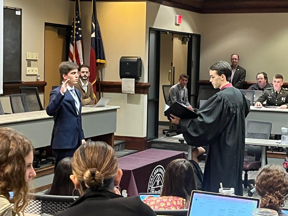 Following the impeachment of Texas A&M’s former student body president, former Speaker of the Student Senate Andrew Applewhite, left, was officially sworn in by Judicial Court Chief Justice Sawyer Bagley, right, to assume his presidency on Wednesday, Oct. 11, 2023.