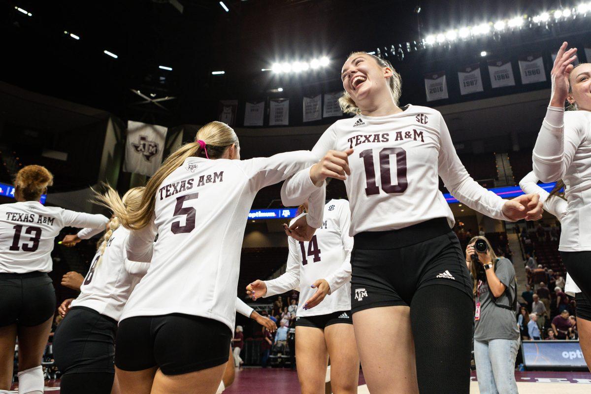 Sophomore OH Lexi Guinn (5) and Freshman S Margot Manning (10) celebrate after Texas A&Ms win against Mississippi State at Reed Arena on Wednesday, Sept. 20, 2023.