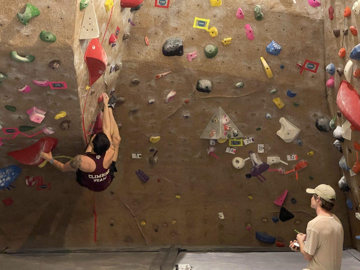 Electrical engineering senior Matthew Masters climbs a route during men&#8217;s finals at A&amp;M&#8217;s Student Rec Center on Oct. 21.