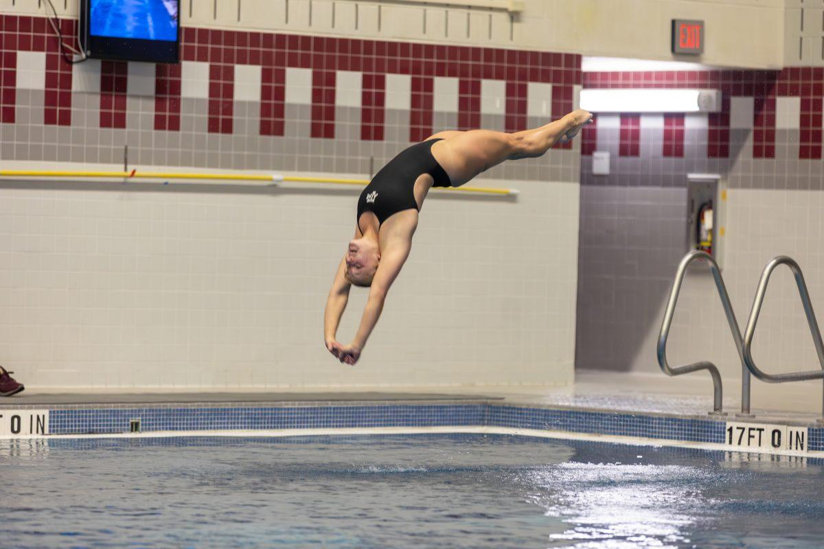 Texas A&M diver prepares to enter the water during Texas A&Ms swim meet against UIW on Friday, Sept. 29, 2023 at Rec Center Natatorium. (CJ Smith/The Battalion)