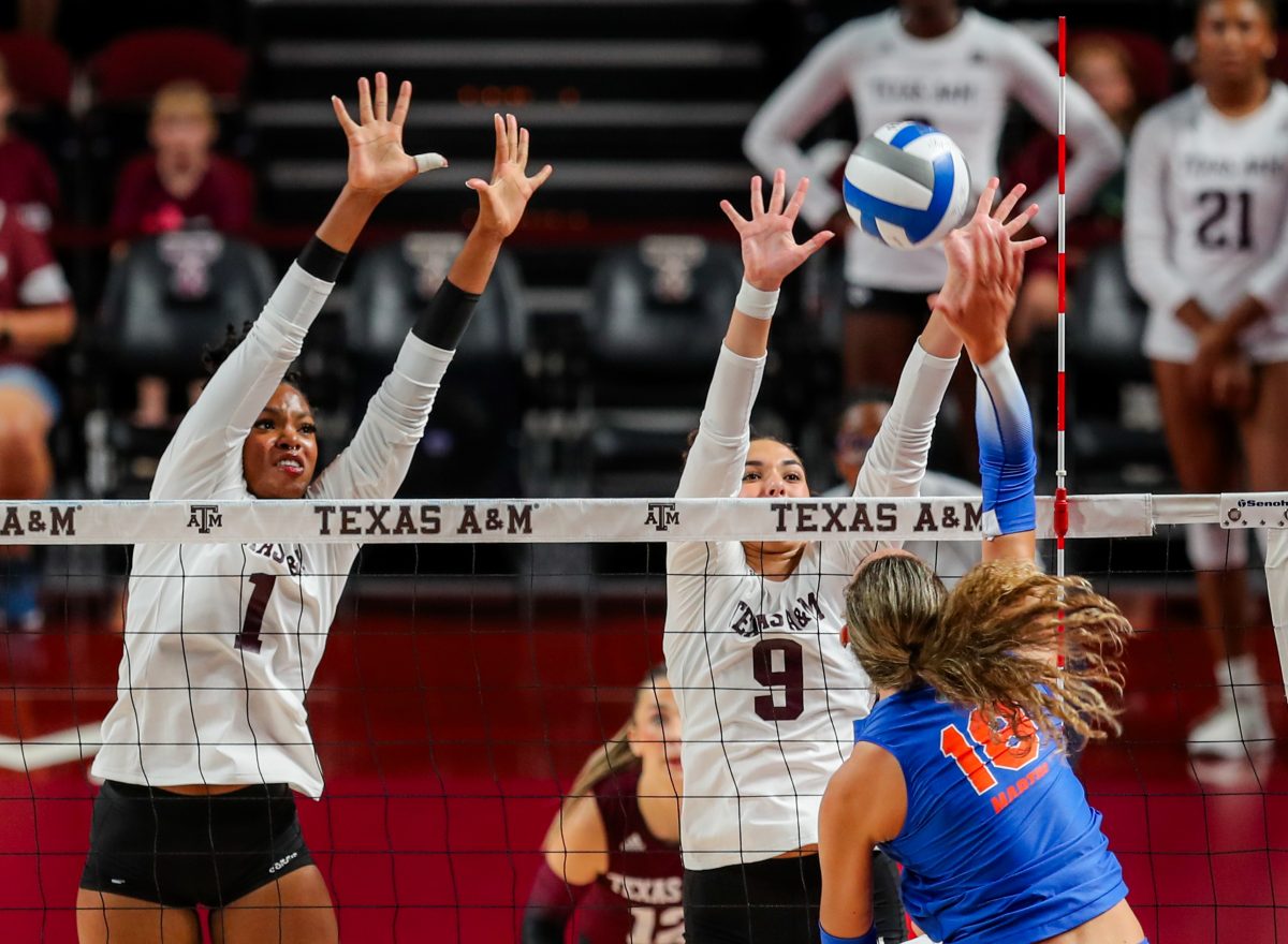 Sopomore MB Ifenna Cos-Okpalla (1) and sophomore OPP Logan Lednicky (9) block the ball during Texas A&Ms game against Florida on Friday, Oct. 20, 2023 at Reed Arena. (Ishika Samant/The Battalion)