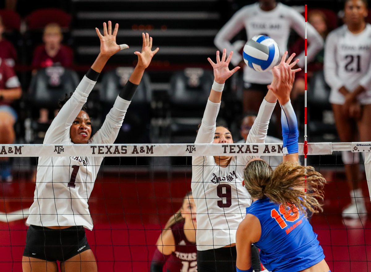 Sopomore MB Ifenna Cos-Okpalla (1) and sophomore OPP Logan Lednicky (9) block the ball during Texas A&amp;M's game against Florida on Friday, Oct. 20, 2023 at Reed Arena. (Ishika Samant/The Battalion)