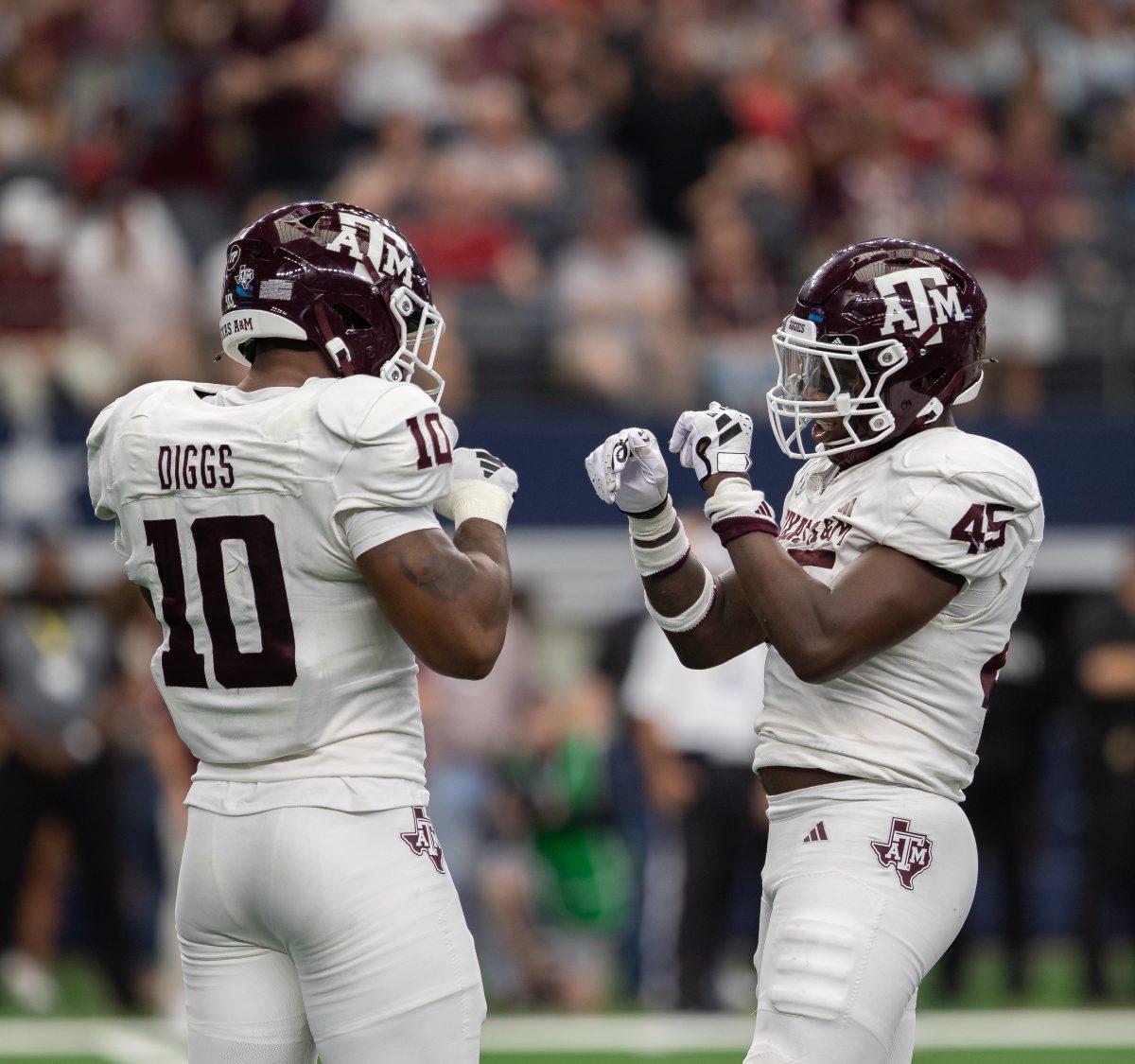 Junior DL Fadil Diggs (10) and junior LB Edgerrin Cooper (45) celebrate after making a sack during the Southwest Classic against Arkansas on Saturday, Sept. 30, 2023. (Kyle Heise/The Battalion)