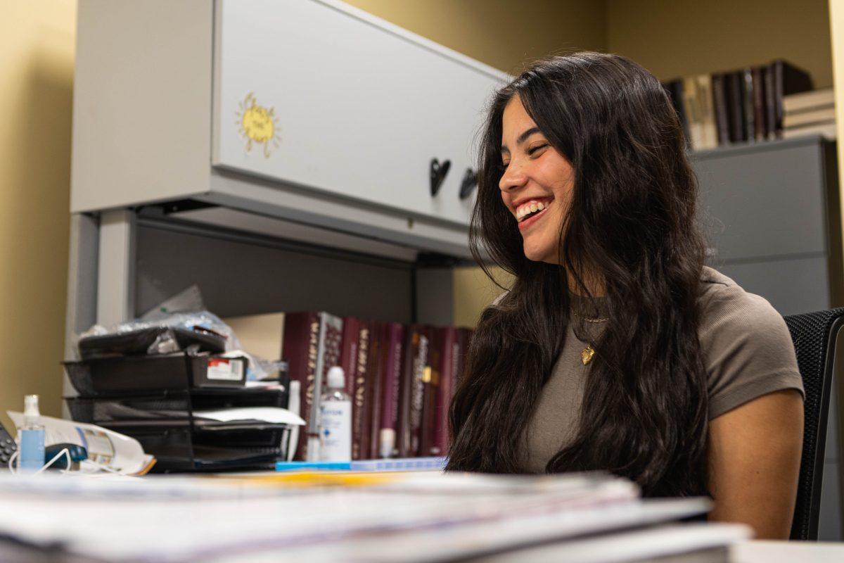 Junior Aggieland Yearbook Editor-in-Chief Emily Escobedo sits in her office in the Memorial Student Center on Thursday, Oct. 5, 2023. Escobedo will lead a newly-expanded team to put the next edition of the yearbook together for the academic year. (Chris Swann/The Battalion)