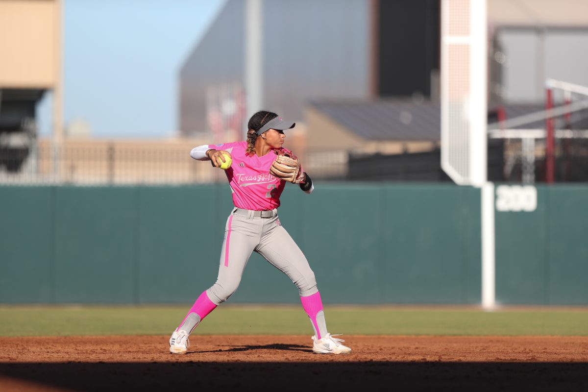 Senior INF Rylen Wiggins goes to throw the ball to first at the Texas A&amp;M scrimmage against Blinn College on Oct.19, 2023 at Davis Diamond. (Julianne Shivers/ The Battalion)