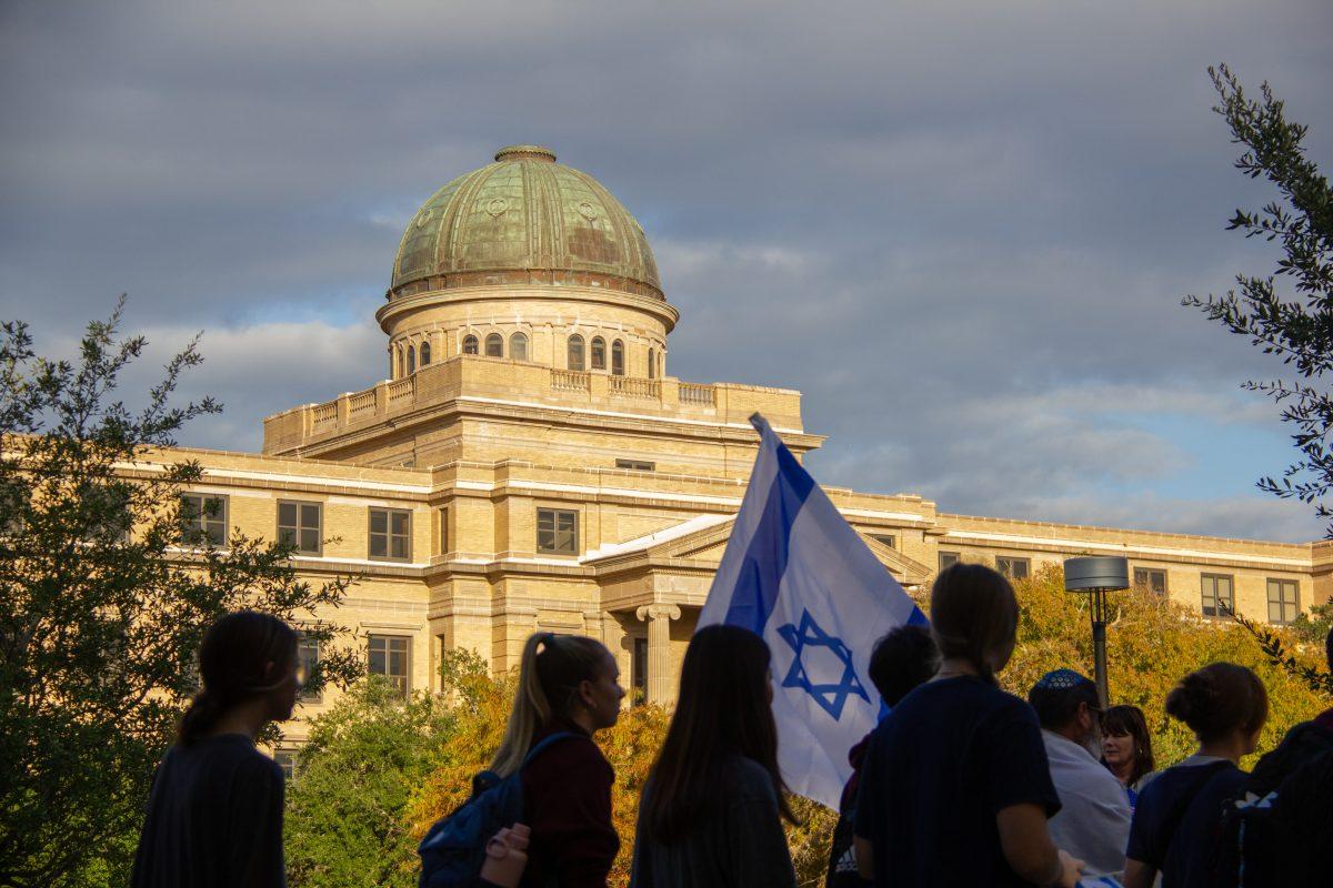 The march passes the Academic Building at the Aggies Stand with Israel March on Thursday, Oct. 12, 2023 (Adriano Espinosa/ The Battalion).