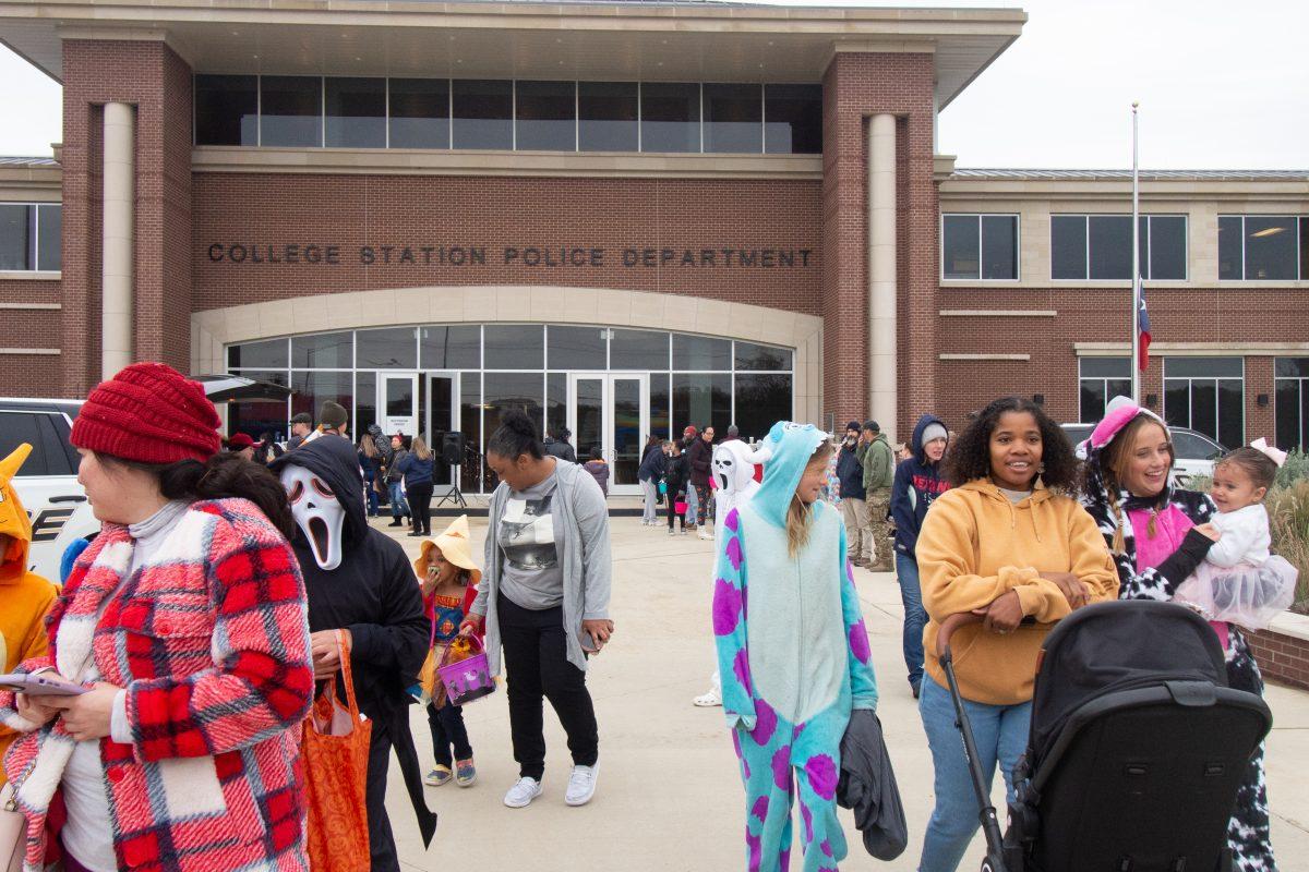 Local families mill about the Cops and Goblins event on Oct. 30, 2023 at the College Station Police Department. (Fayobami Taiwo/The Battalion)