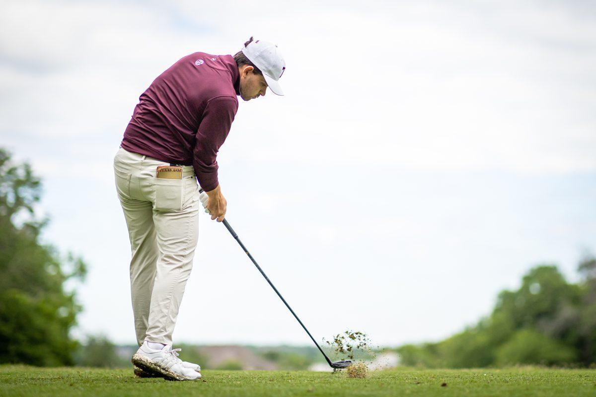 <p>Junior Daniel Rodrigues plays his tee shot on the fourth hole of the Traditions Club on the second day of the Aggie Invitational on Tuesday, April 11, 2023.</p>