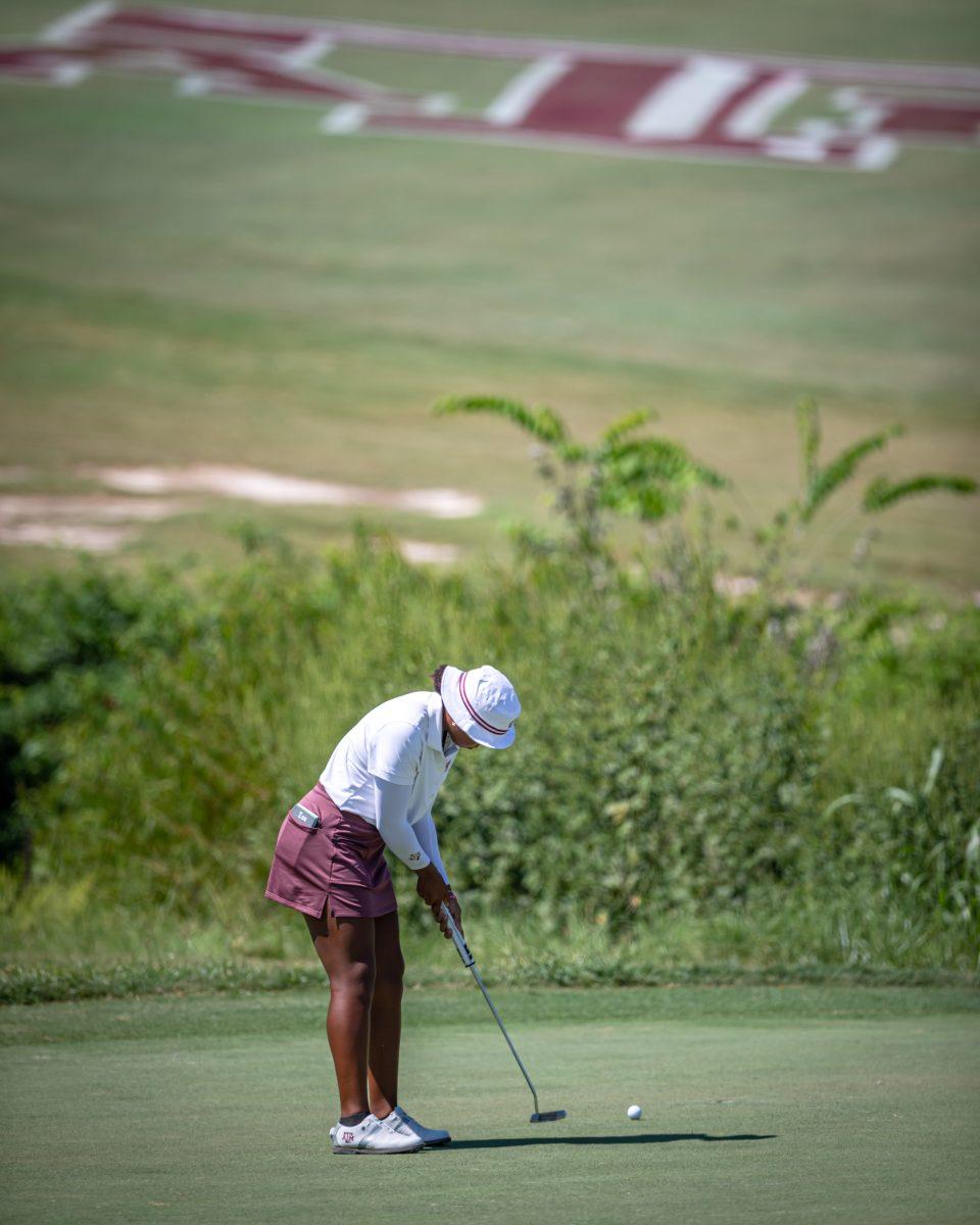 Junior Zoe Slaughter putts on the green of the 18th hole of the Traditions Club on the second day of the Momorial Invitational on Wednesday, Sept. 21, 2022 in Bryan, Texas.