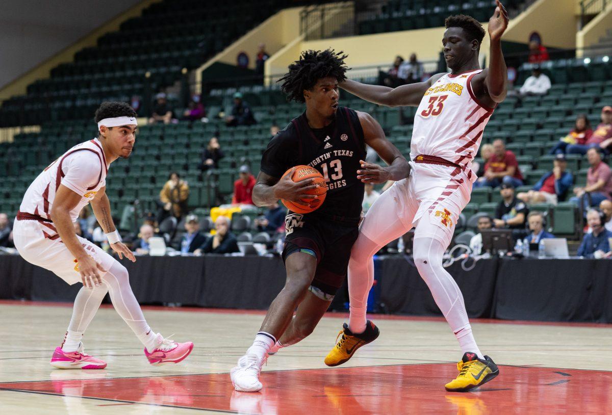 <p>Sophomore F Solomon Washington (13) drives to the basket during Texas A&M's game against Iowa State at the ESPN Events Invitational in Kissimmee, Florida on Sunday, Nov. 26, 2023.</p>