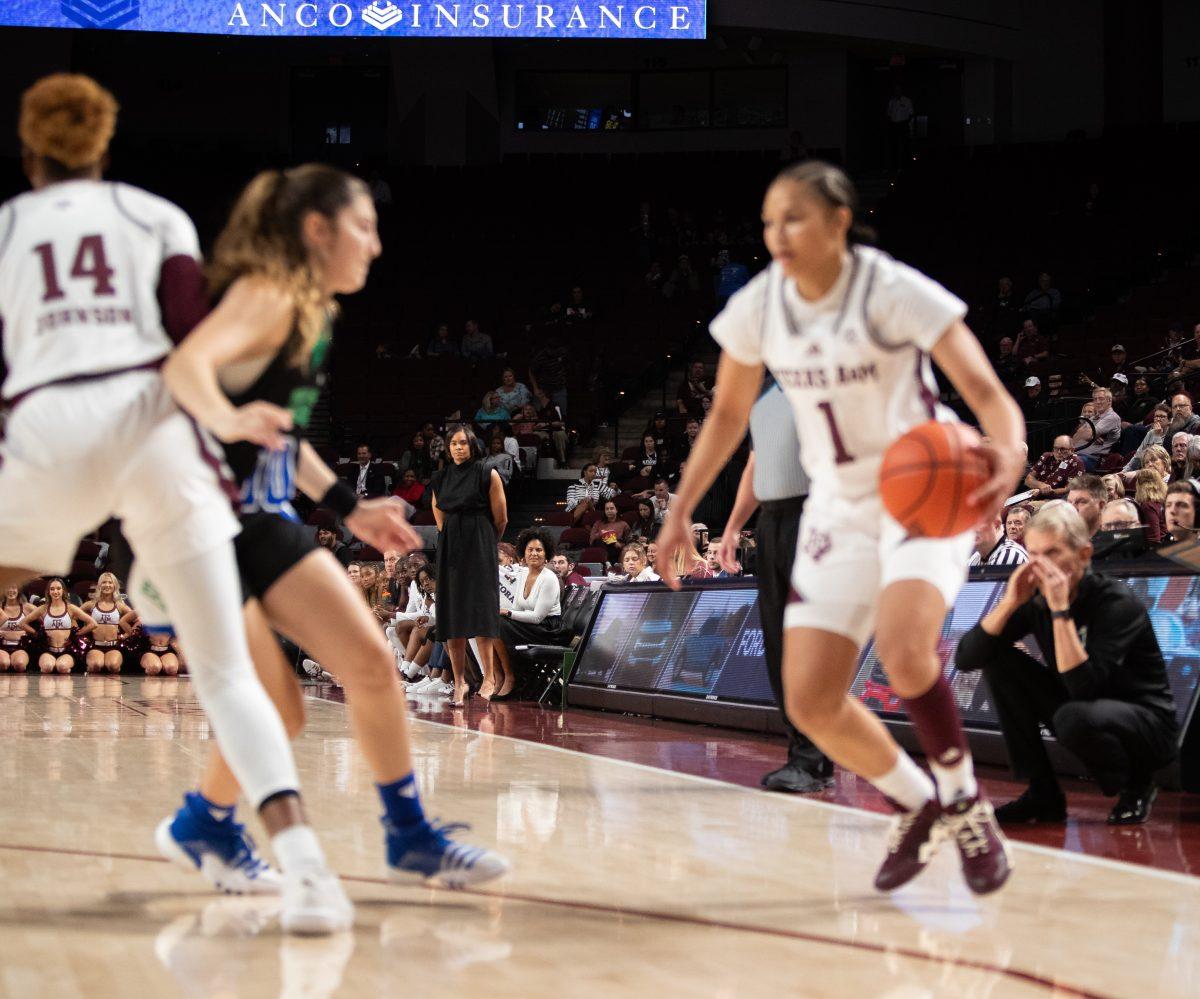 Head coach Joni Taylor watches as graduae G Endyia Rogers (1) dribbles on offense during Texas A&Ms game against A&M-Corpus Christi in Reed Arena on Thursday, Nov. 9, 2023.