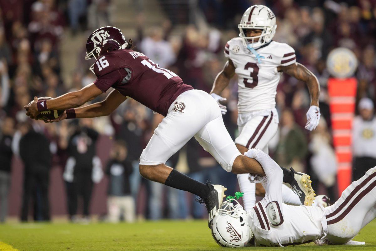 Sophomore QB Jaylen Henderson (16) dives into the endzone for a touchdown during Texas A&Ms game against Mississippi State on Saturday, Nov. 11, at Kyle Field. (Ishika Samant/The Battalion)
