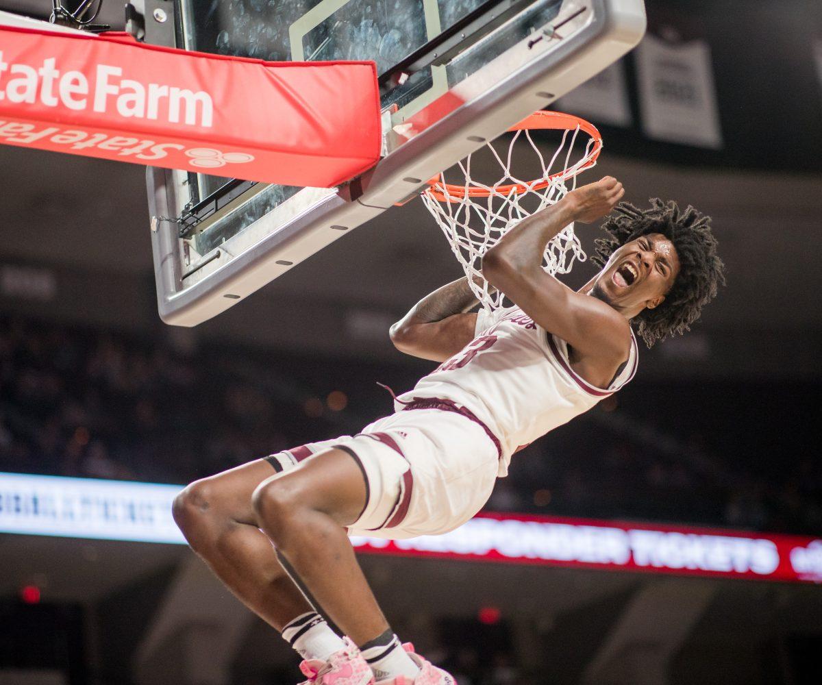 Sophomore F Solomon Washington (13) dunks the ball during the first half of Texas A&Ms game against A&M-Commerce on Monday, Nov. 6, 2023 at Reed Arena. (Ishika Samant/The Battalion)
