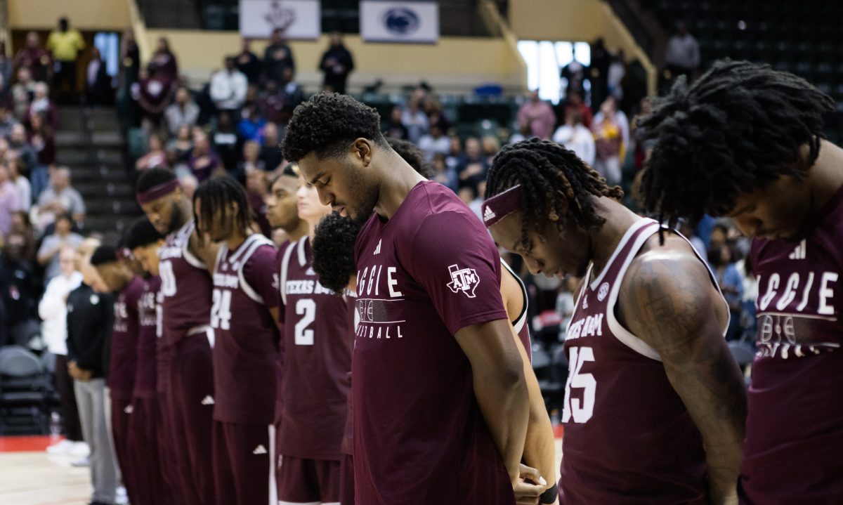 Senior F Henry Coleman III bows his head during the national anthem before Texas A&Ms game against FAU at the ESPN Events Invitational in Kissimmee, Florida on Friday, Nov. 24, 2023.