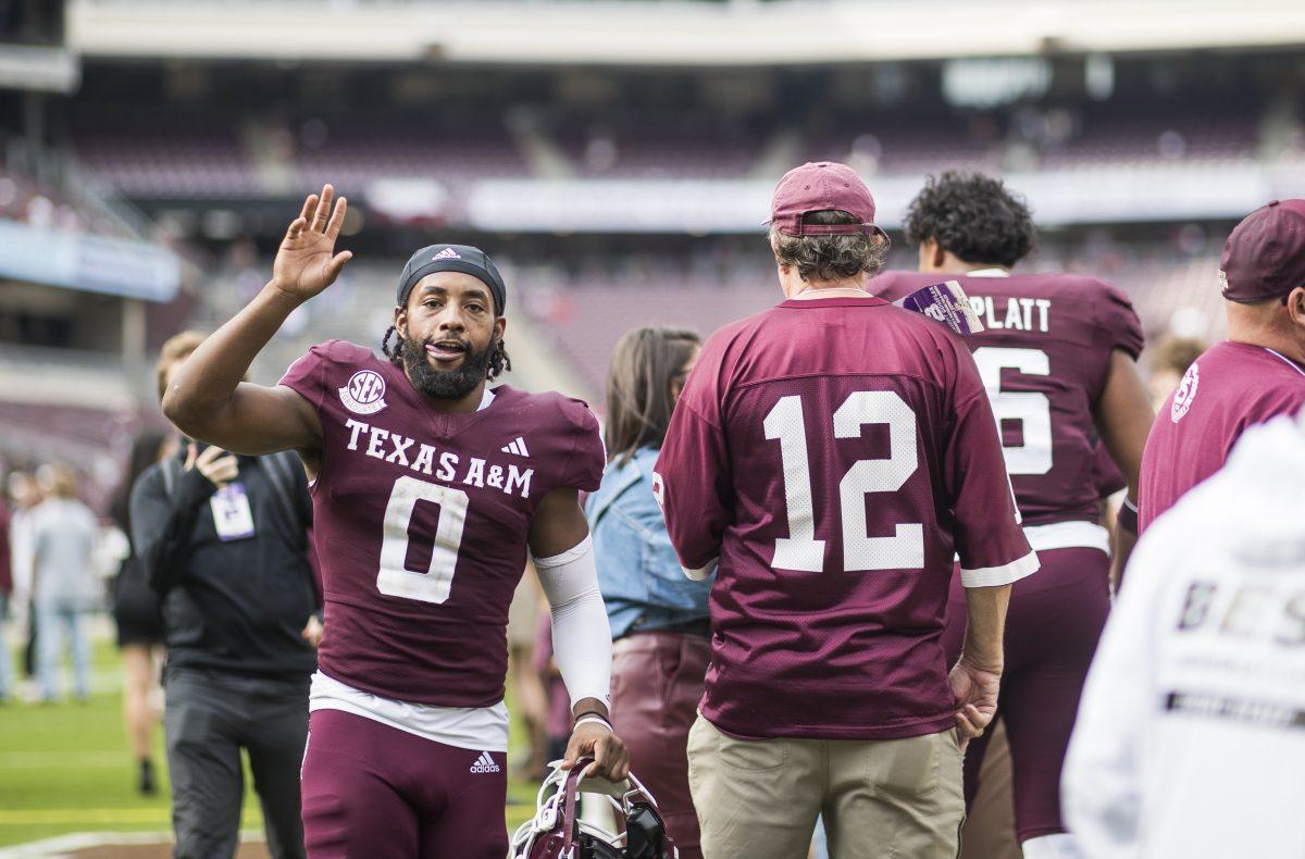 <p>Graduate WR Ainais Smith (0) waves as he walks off the field during Texas A&M's game against ACU on Saturday, Nov. 18, 2023 at Kyle Field. (Ishika Samant/The Battalion)</p>