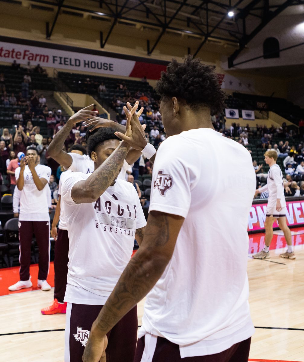 Junior G Wade Taylor IV (4) does a handshake with graduate G Eli Lawrence (5) during pregame introductions before Texas A&Ms game against Penn State at the ESPN Events Invitational in Kissimmee, Florida on Thursday, Nov. 23, 2023.