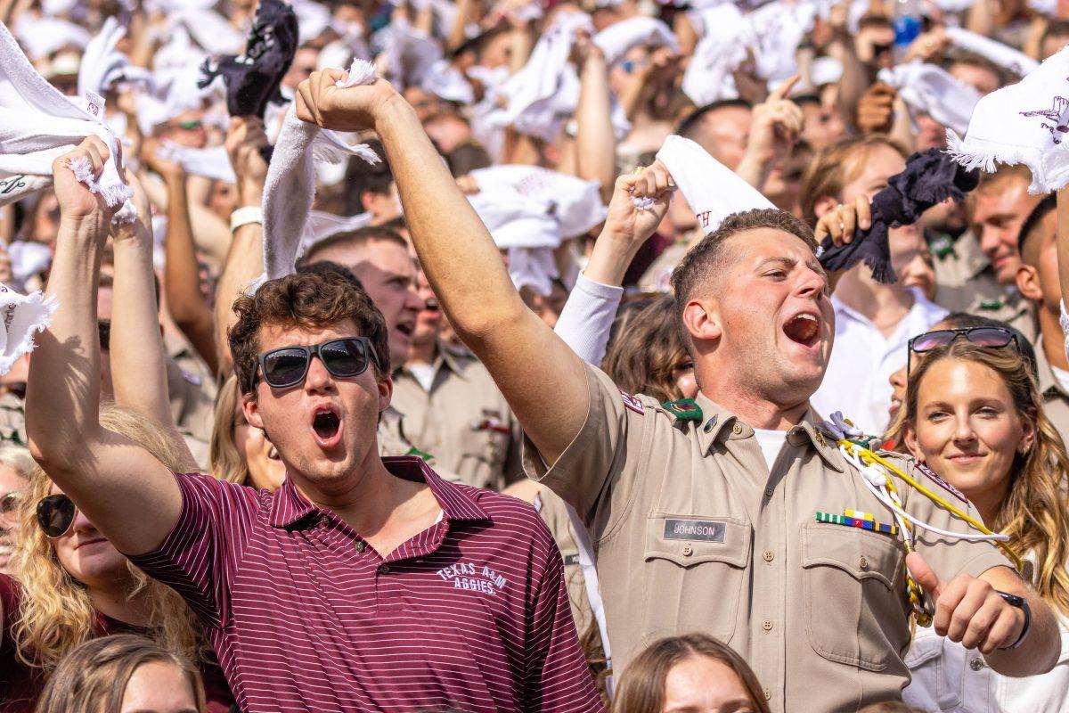 Two+fans+cheer+during+Texas+A%26amp%3BMs+football+game+against+Alabama+at+Kyle+Field+on+Saturday%2C+Oct.+7%2C+2023.+%28Chris+Swann%2FThe+Battalion%29