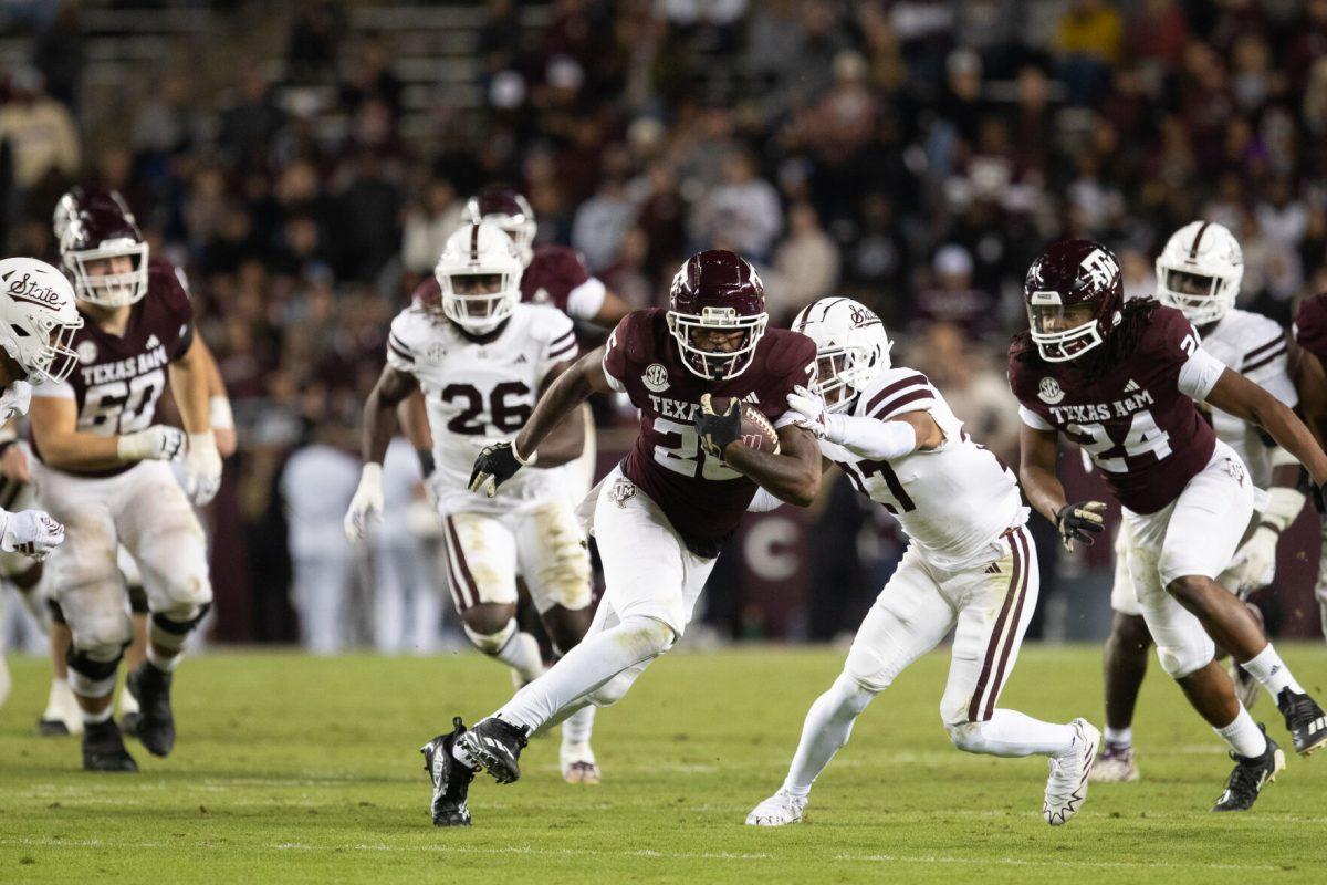 Senior DB Demani Richardson (26) runs the ball for a first down in Texas A&amp;M's game against Mississippi State on Saturday, Nov. 11, 2023 at Kyle Field. (Julianne Shivers/ The Battalion)