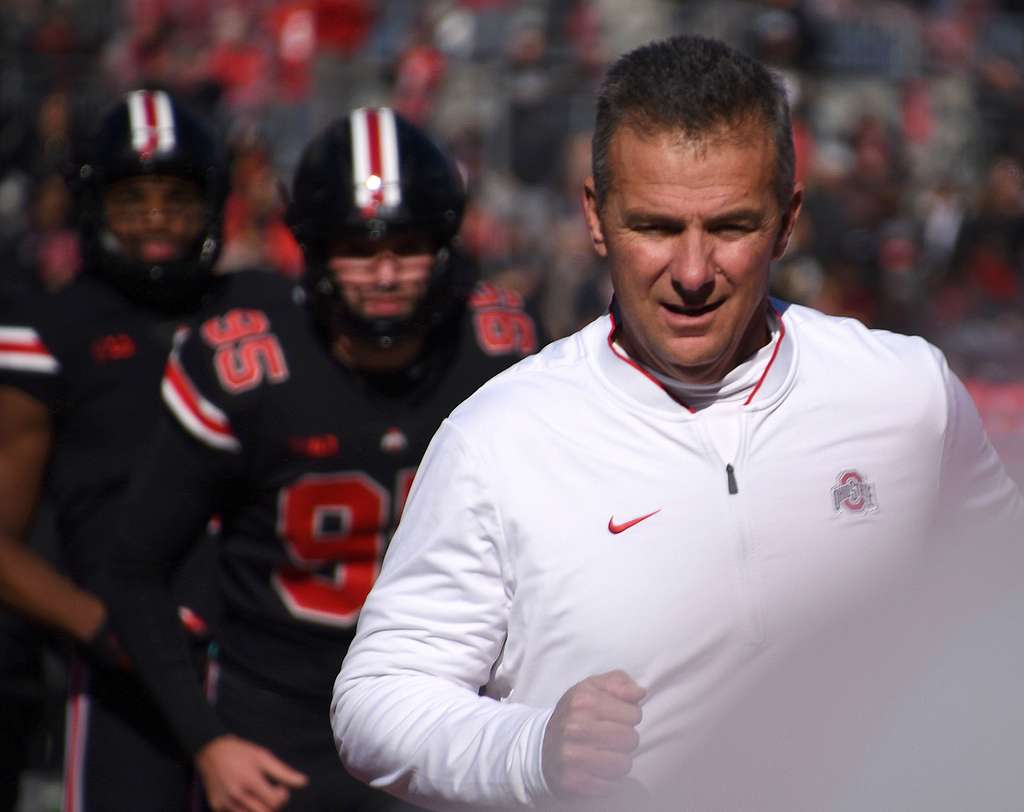 Coach+Urban+Meyer+runs+on+the+field+during+the+Ohio+State+military+appreciation+game+on+November+3%2C+2018%2C+in+Columbus%2C+Ohio.+This+game+was+dedicated+to+honoring+military+men+and+women+for+Veterans+Day.