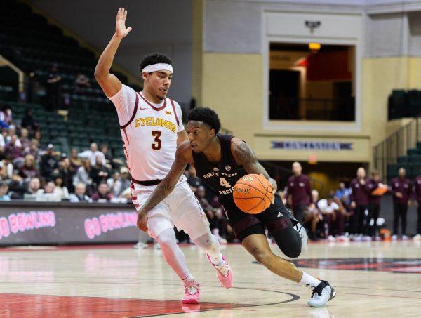 Junior G Wade Taylor IV (4) drives to the basket during Texas A&M's game against Iowa State at the ESPN Events Invitational in Kissimmee, Florida on Sunday, Nov. 26, 2023.