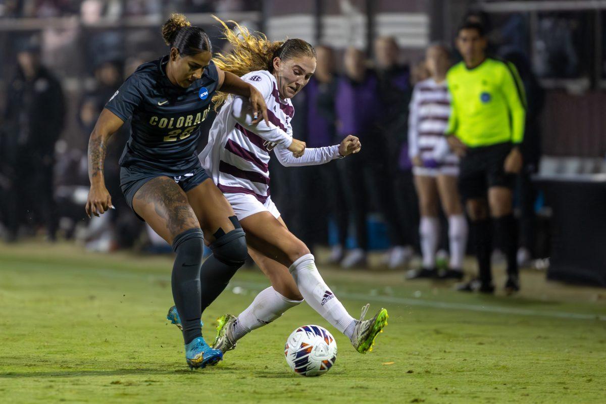 Junior M/D Mia Pante (13) fights for the ball against Colorado forward Shyra James (20) during Texas A&Ms game against Colorado on Friday, Nov. 10, 2023 at Ellis Field. (CJ Smith/The Battalion)